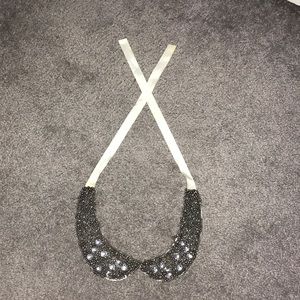 Bejeweled collar.